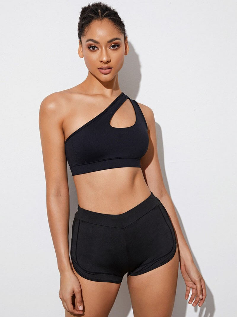 Stylish women's one-shoulder sports bra in black, perfect for fitness, made of breathable spandex and nylon, model SF0981.
